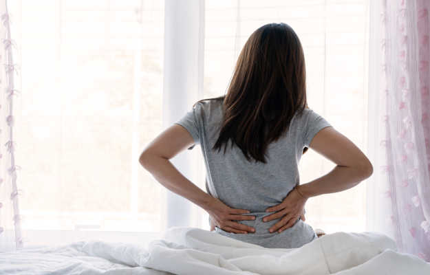 Why is there back pain after missed period?